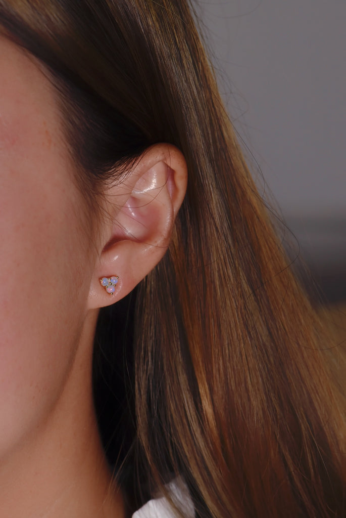 Three Petals Opal Earrings on ear
