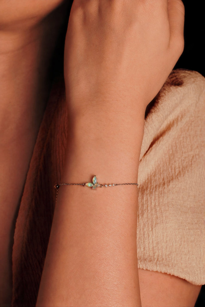 Model Wearing Butterfly Opal Bracelet with Diamonds in White Gold