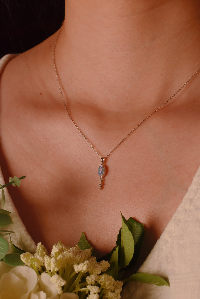 Model wearing a Cascade Opal Necklace with Diamonds in White Gold