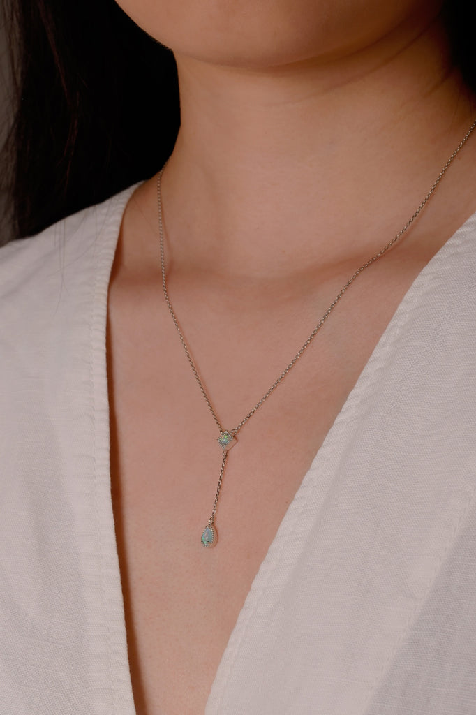 Model Wearing a Kite Opal Necklace in White Gold