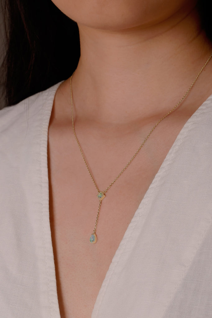 Model Wearing a Kite Opal Necklace in Yellow Gold