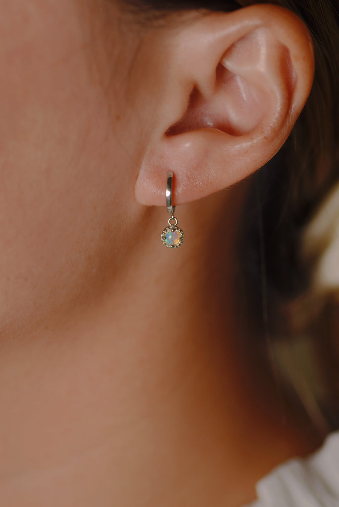 Model wearing Bliss Opal Drop Earrings in White Gold, Blue