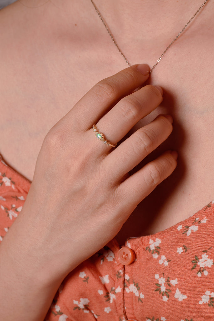 Model wearing Cascade Opal Ring with Diamonds in Yellow Gold
