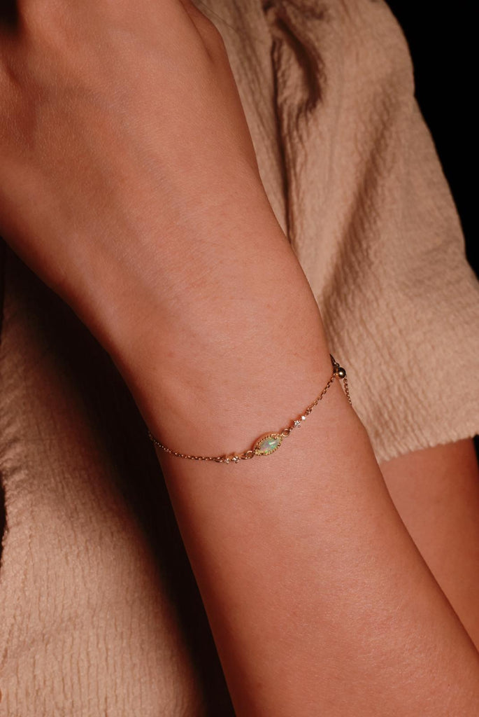 Model Wearing Casecade Opal Bracelet set with diamonds in yellow gold