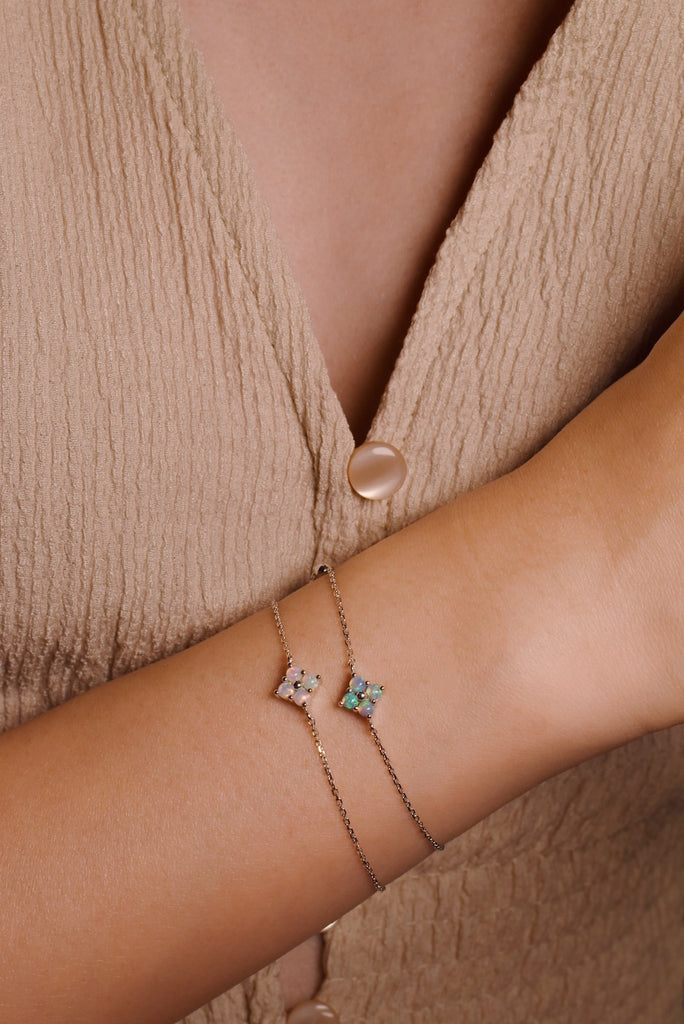 Model wearing Clover Bracelets with Opals in White Gold