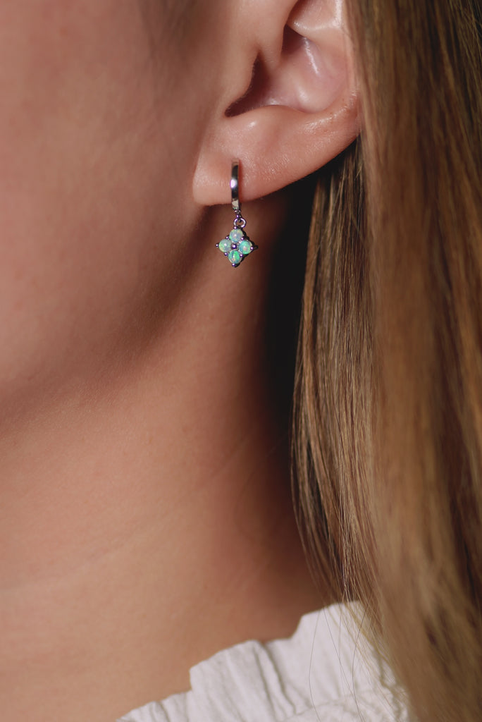 Model wearing Clover Opal Drop Earrings in White Gold
