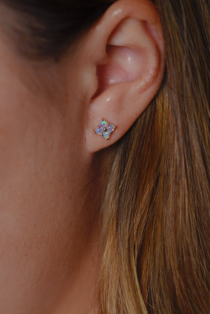 Model wearing Clover Opal Earrings in Yellow Gold, Blue