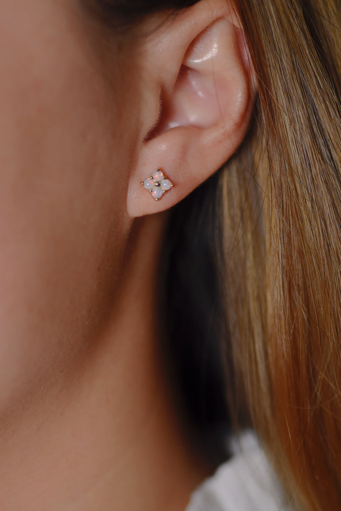 Model wearing Clover Opal Earrings in Yellow Gold, White