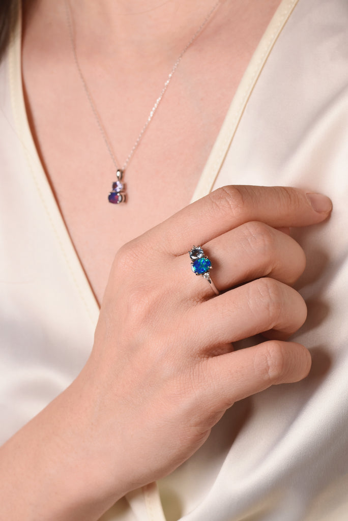 Model wearing Elysia Opal Ring with Blue Sapphire and Diamonds in Rose Gold
