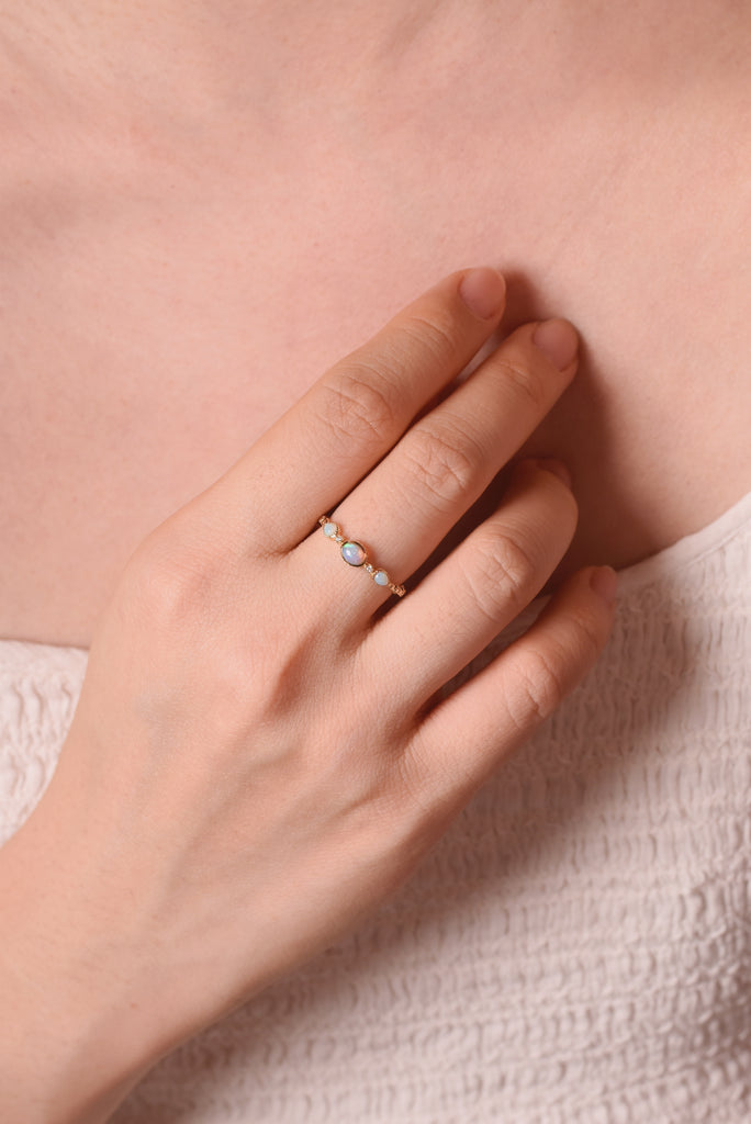 Model Wearing Hitomi Opal Ring with Diamonds in Yellow Gold
