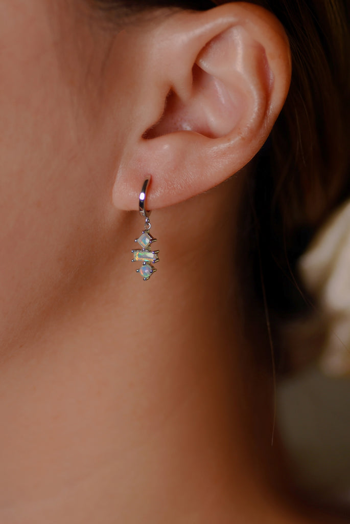 Model wearing Katachi Opal Drop Earrings in White Gold