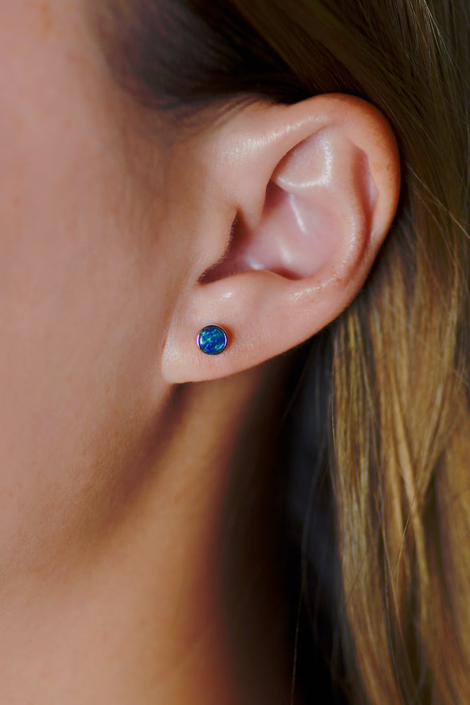 Model wearing Round Opal Stud Earrings in Sterling Silver, Doublet Blue Green