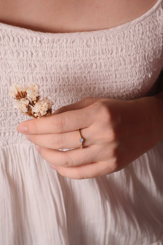 Model wearing Yuzuki Opal Ring with Diamonds in Yellow Gold
