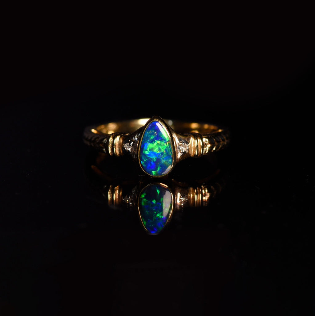 Wheat Opal Vintage Ring with Diamonds in Yellow Gold on dark background