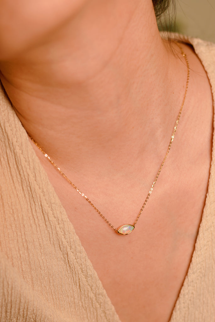Model wearing a Marquise Opal Necklace in Yellow Gold
