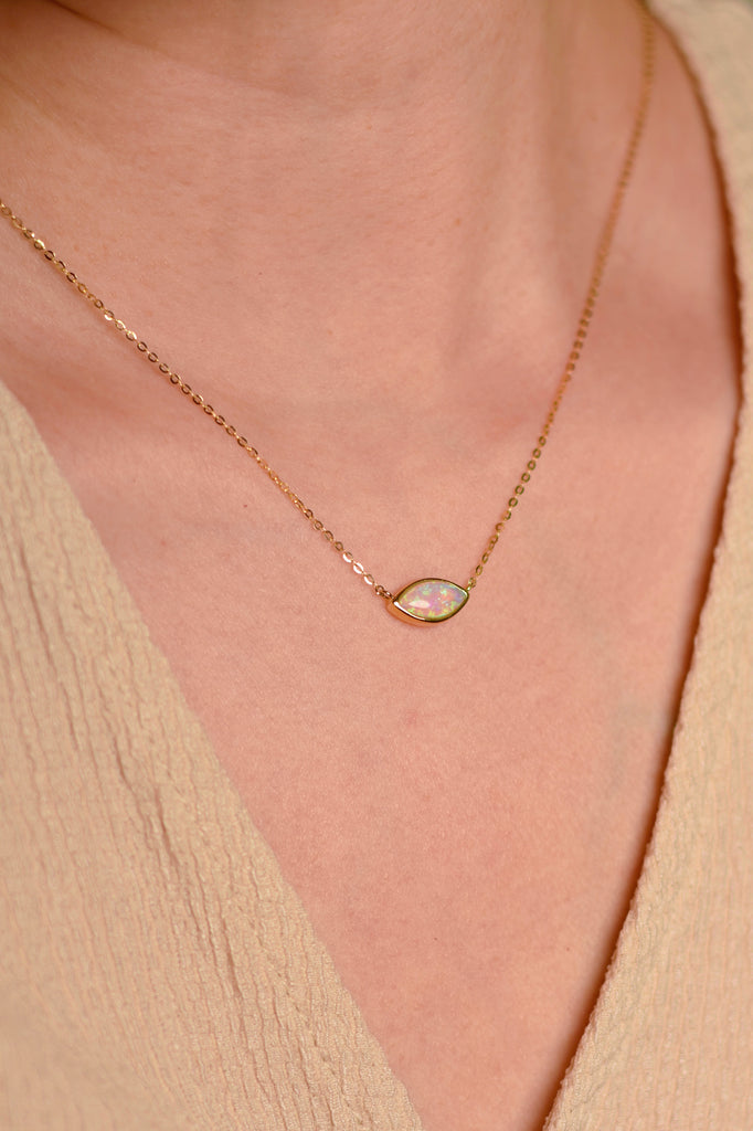 Model wearing a Marquise Opal Necklace in Yellow Gold
