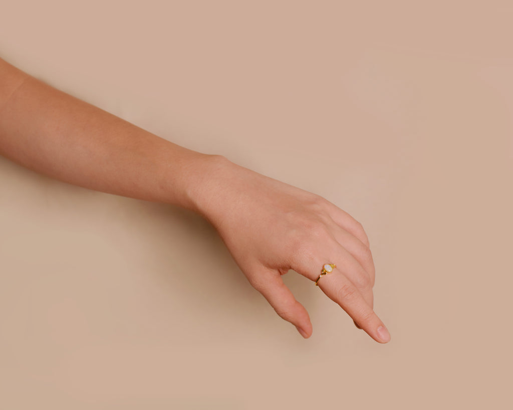 Model wearing Bean Sprout Opal Ring in Sterling Silver, Yellow Gold Plated
