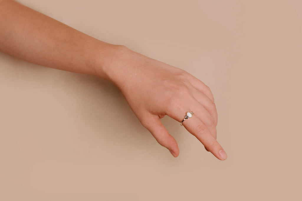 Model wearing Bean Sprout Opal Ring in Sterling Silver