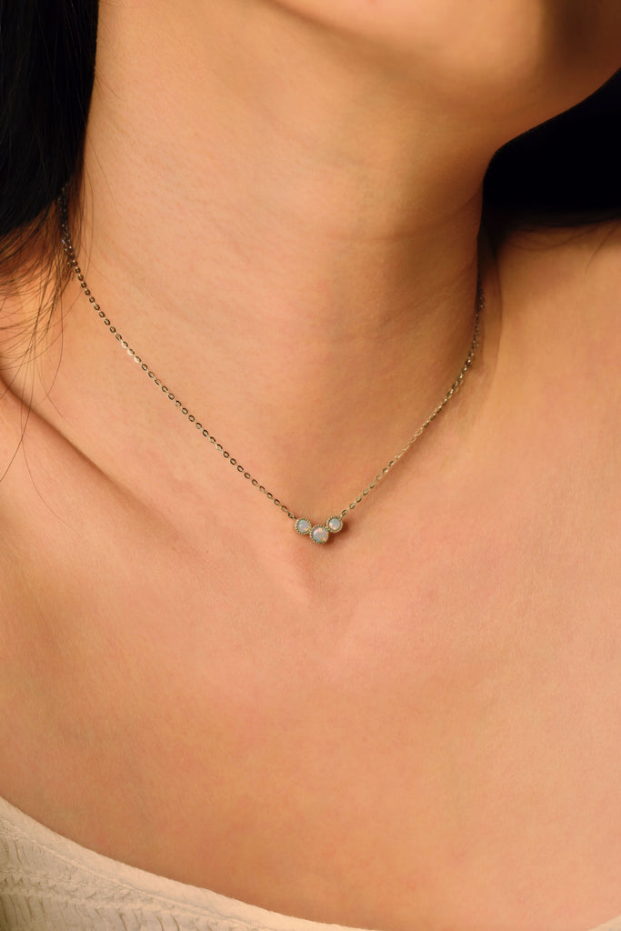 Model wearing Bliss White Opal Necklace in Sterling Silver, Three Stones