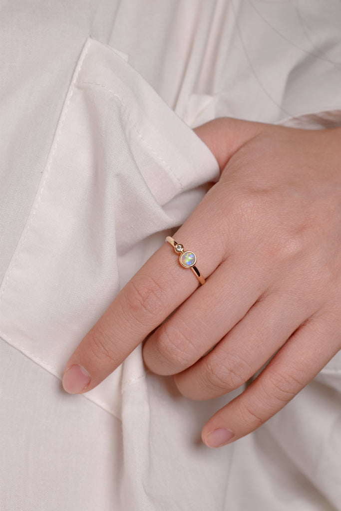 Model wearing Bubble Opal Ring with Diamond in Yellow Gold