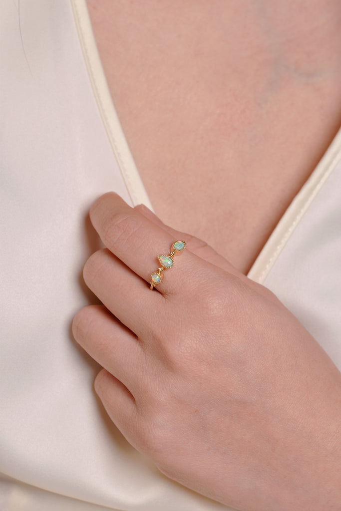 Model wearing Fête Opal Ring in Yellow Gold