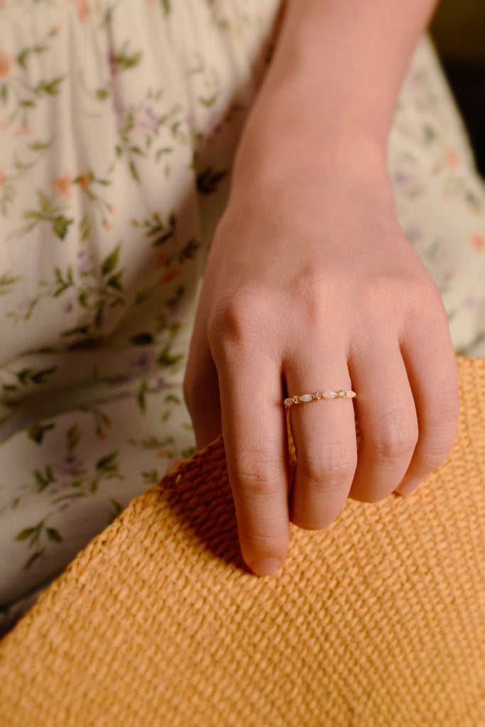 Model wearing Marquise Opal Band Ring in Sterling Silver, Yellow Gold Plated