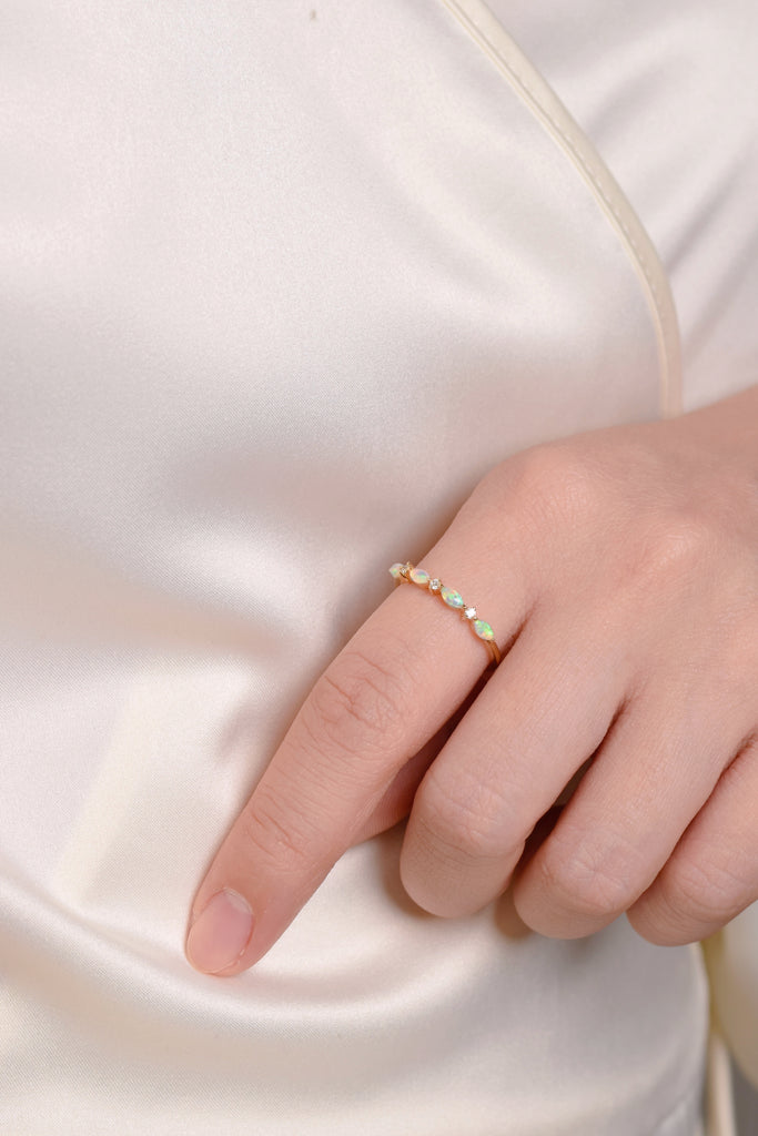 Model wearing Marquise Opal Band Ring with Diamonds in Yellow Gold, Green