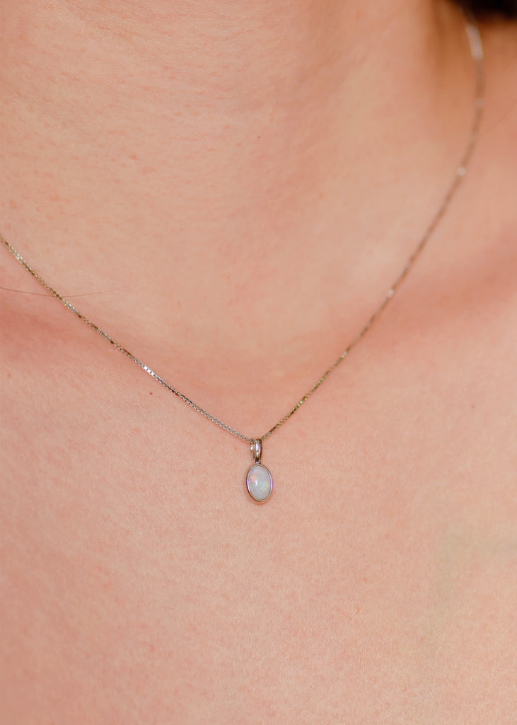 Model wearing Mini Oval Opal Necklace in Sterling Silver