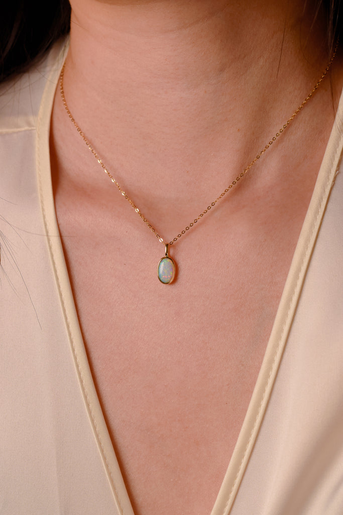 Model wearing Nocturne 9 Op. 2 Opal Necklace in Yellow Gold