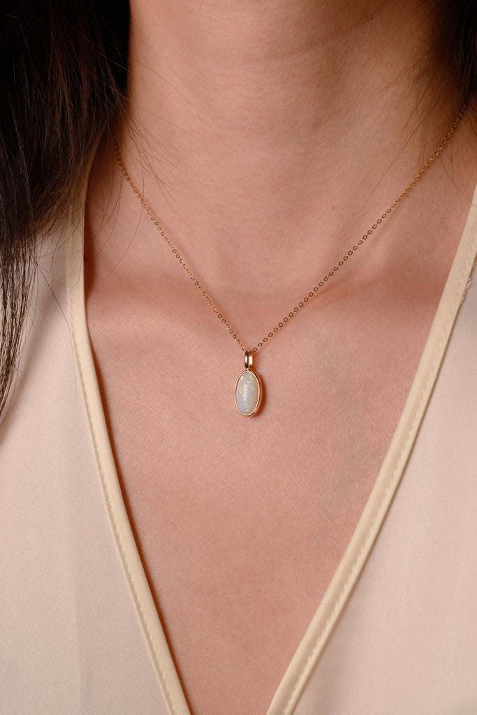 Model wearing Seraphina Opal Necklace in Yellow Gold