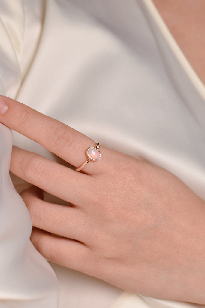 Model wearing Serenus Opal Ring with Diamond in Yellow Gold