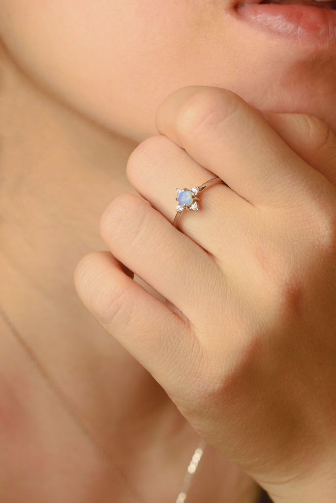 Model wearing Starlike Opal Ring in Sterling Silver