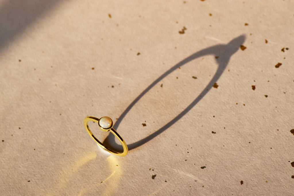 Round White Opal Ring in Sterling Silver, Yellow Gold Plated - Mood Shot