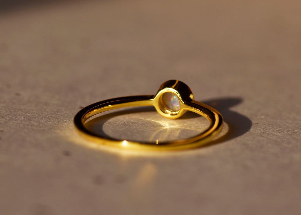Round White Opal Ring in Sterling Silver, Yellow Gold Plated - Mood Shot