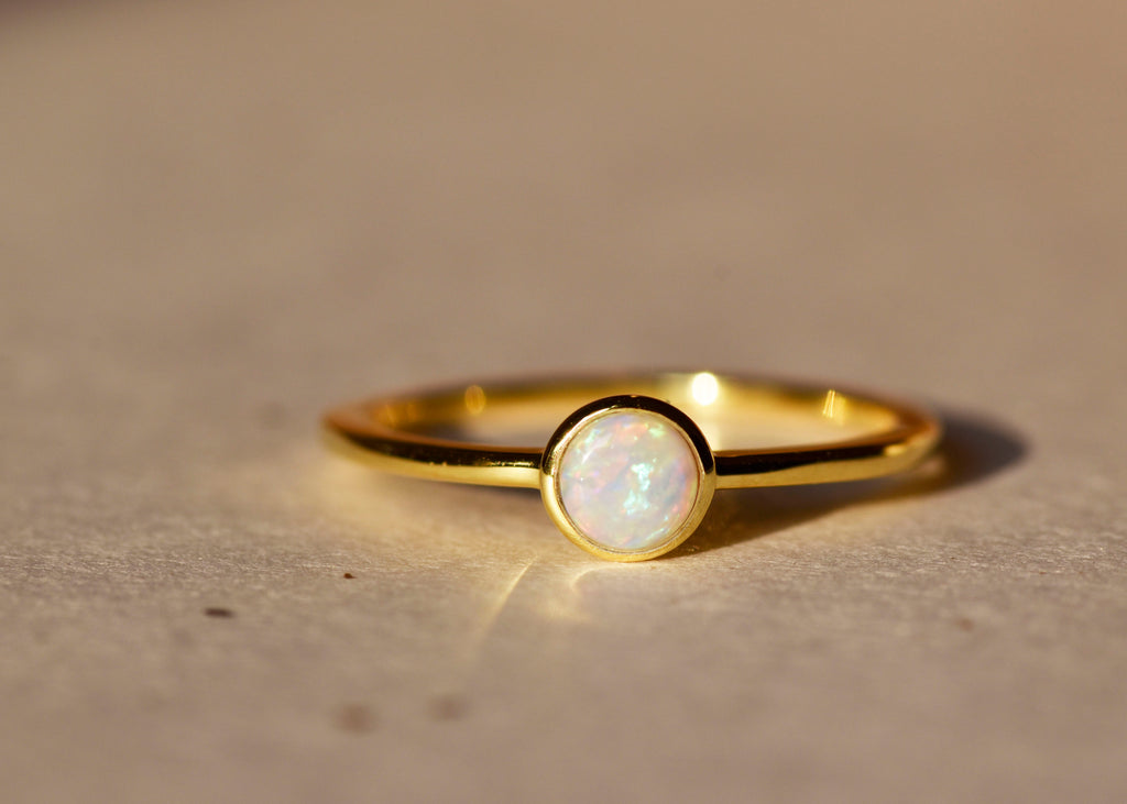 Round White Opal Ring in Sterling Silver, Yellow Gold Plated - Mood Shot